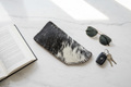 Cowhide lifestyle - marble countertop flat lay